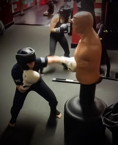 Justina training hard alongside her coach at Lou Neglia Martial Arts