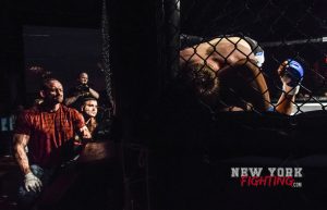 Austin in the cage as trainers Spiro and Keith of Bell,ore Kickboxing MMA coach from outside the cage